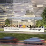 Children’s of Mississippi building front with cars passing by